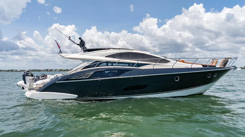Inverse Entropy Yacht Photos Pics 2009 Marquis 500 Sport Coupe yacht cruising on a sunny day.