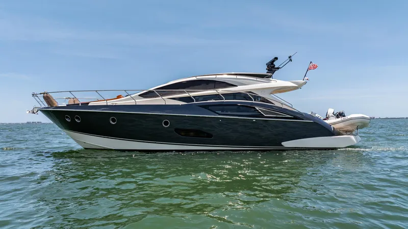 Inverse Entropy Yacht Photos Pics 2009 Marquis 500 Sport Coupe yacht cruising on open water under clear blue sky.