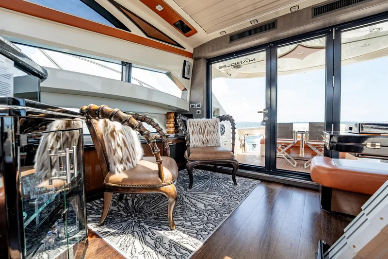 Inverse Entropy Yacht Photos Pics Luxurious interior of 2009 Marquis 500 Sport Coupe yacht with elegant seating and modern design.