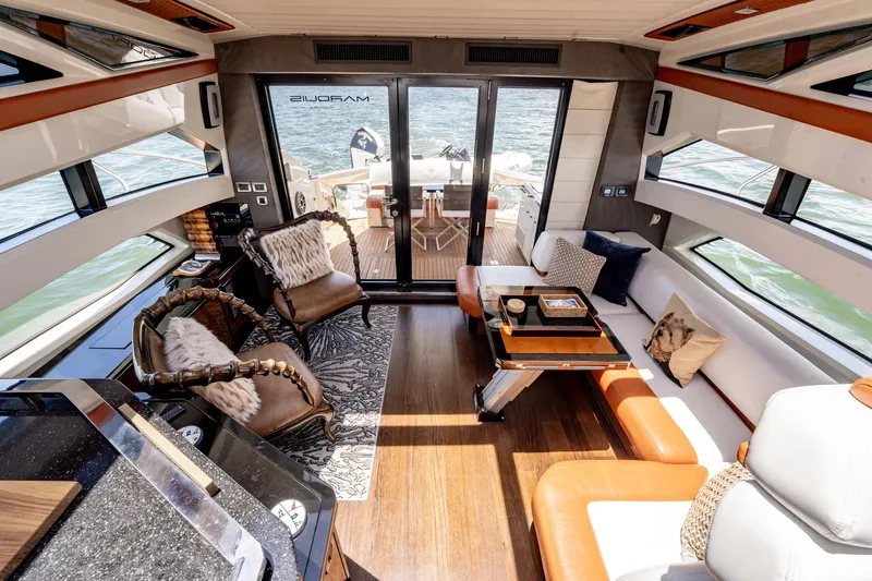 Inverse Entropy Yacht Photos Pics Luxurious interior of 2009 Marquis 500 Sport Coupe yacht with elegant seating and decor.