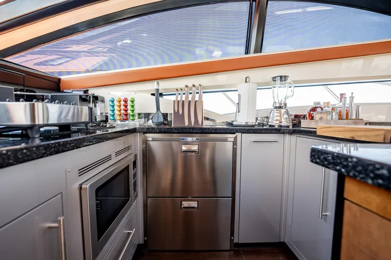 Inverse Entropy Yacht Photos Pics Luxurious kitchen interior of 2009 Marquis 500 Sport Coupe yacht with modern appliances.