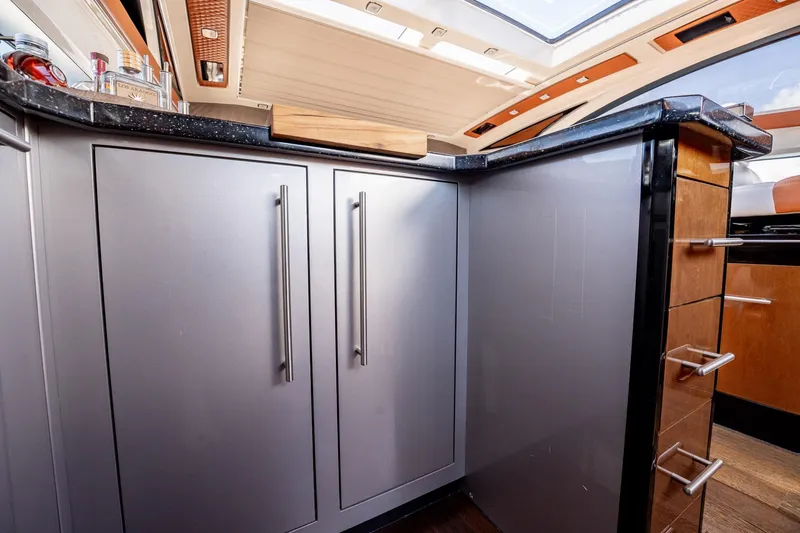 Inverse Entropy Yacht Photos Pics Interior of 2009 Marquis 500 Sport Coupe yacht with modern cabinetry and skylight.