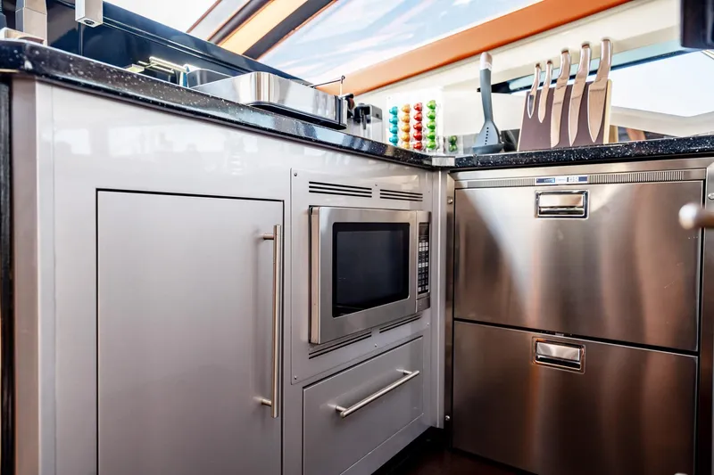 Inverse Entropy Yacht Photos Pics Luxurious kitchen interior of 2009 Marquis 500 Sport Coupe yacht with modern appliances.