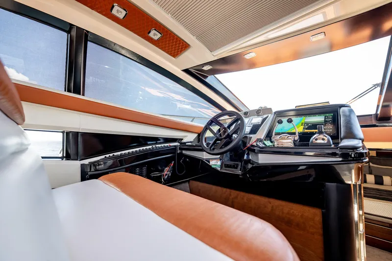 Inverse Entropy Yacht Photos Pics Luxurious interior of a 2009 Marquis 500 Sport Coupe yacht with modern navigation controls.
