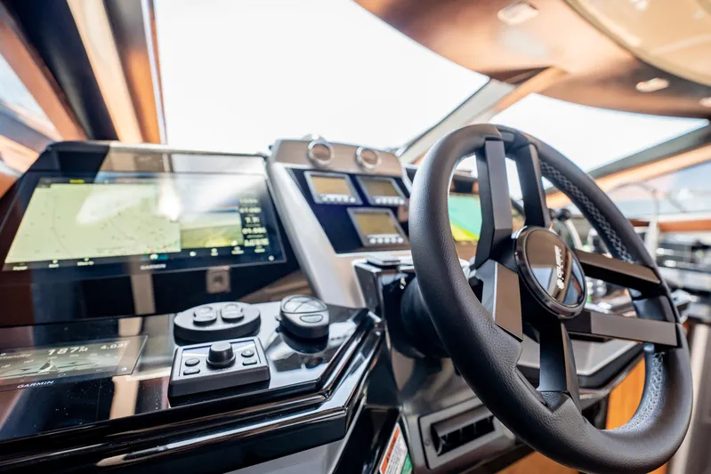 Inverse Entropy Yacht Photos Pics Interior cockpit of 2009 Marquis 500 Sport Coupe yacht with advanced navigation controls.