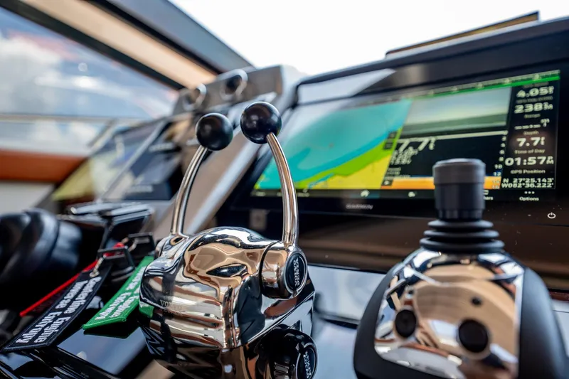 Inverse Entropy Yacht Photos Pics Control panel of 2009 Marquis 500 Sport Coupe yacht with navigation display and throttle levers.