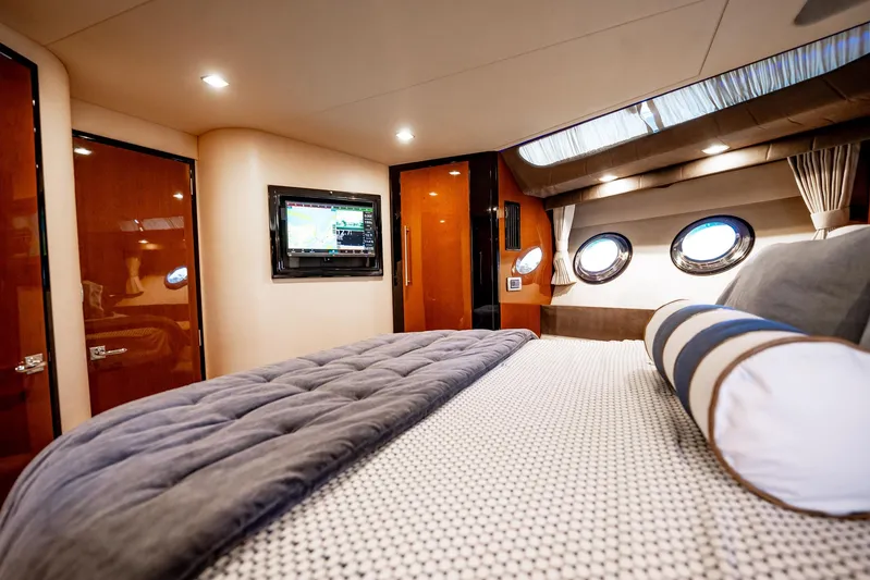 Inverse Entropy Yacht Photos Pics Luxurious interior of 2009 Marquis 500 Sport Coupe yacht with cozy bed and porthole windows.