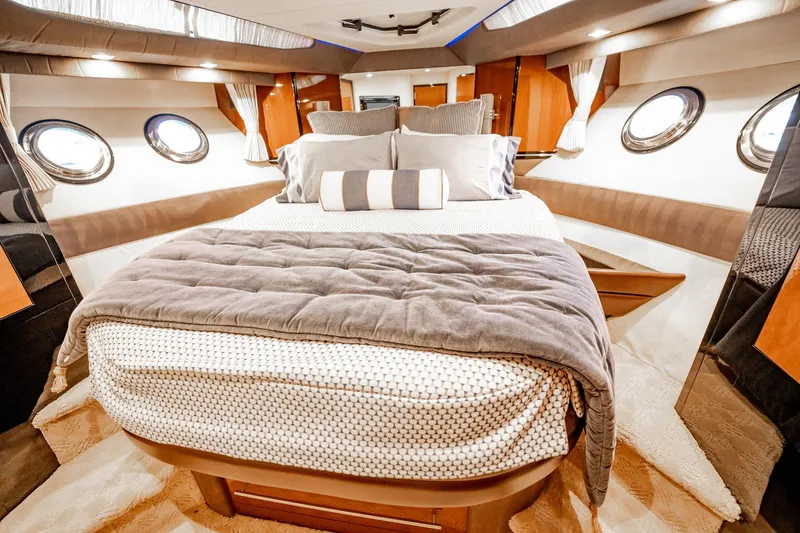 Inverse Entropy Yacht Photos Pics Luxurious interior of 2009 Marquis 500 Sport Coupe yacht bedroom with elegant bedding.