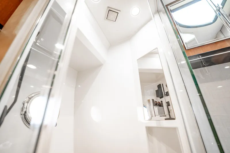 Inverse Entropy Yacht Photos Pics Interior of 2009 Marquis 500 Sport Coupe yacht, featuring sleek white design and modern fixtures.