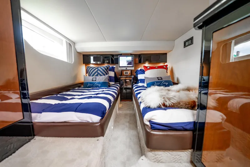 Inverse Entropy Yacht Photos Pics Luxurious 2009 Marquis 500 Sport Coupe cabin with twin beds and nautical decor.