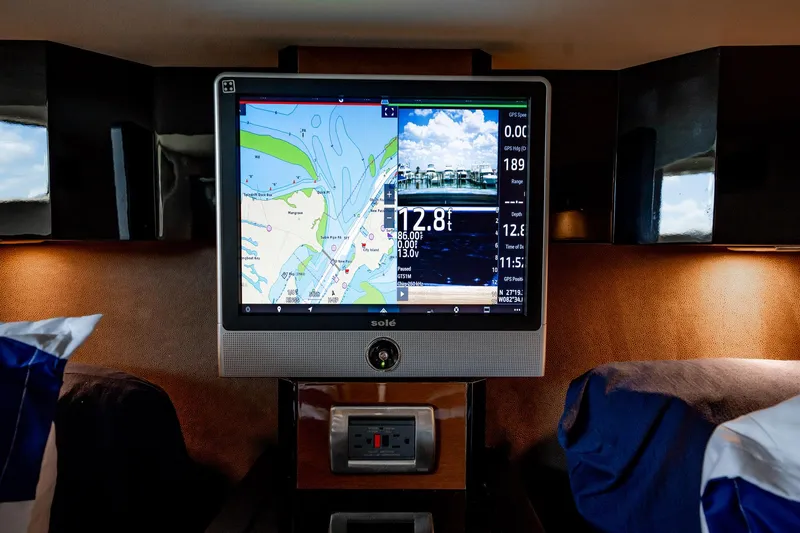 Inverse Entropy Yacht Photos Pics Navigation screen inside 2009 Marquis 500 Sport Coupe yacht cabin, displaying map and data.