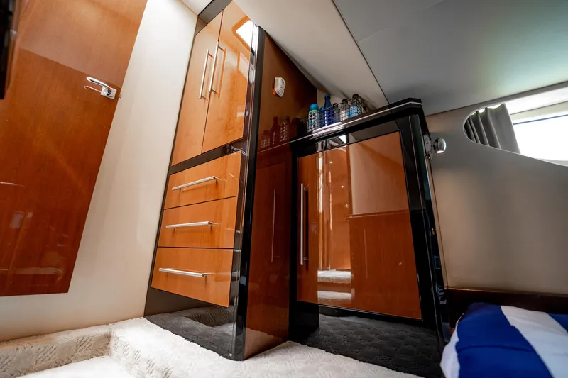 Inverse Entropy Yacht Photos Pics Luxurious interior of 2009 Marquis 500 Sport Coupe with sleek wooden cabinetry.