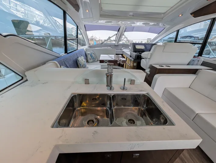 Emilia Yacht Photos Pics Interior of 2022 Cruisers Yachts 54 Cantius with modern kitchen.