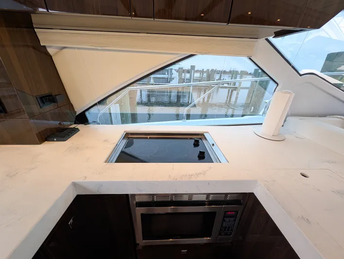 Emilia Yacht Photos Pics Modern kitchen on a 2022 Cruisers Yachts 54 Cantius.