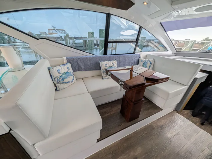Emilia Yacht Photos Pics Interior of 2022 Cruisers Yachts 54 Cantius with elegant seating area.