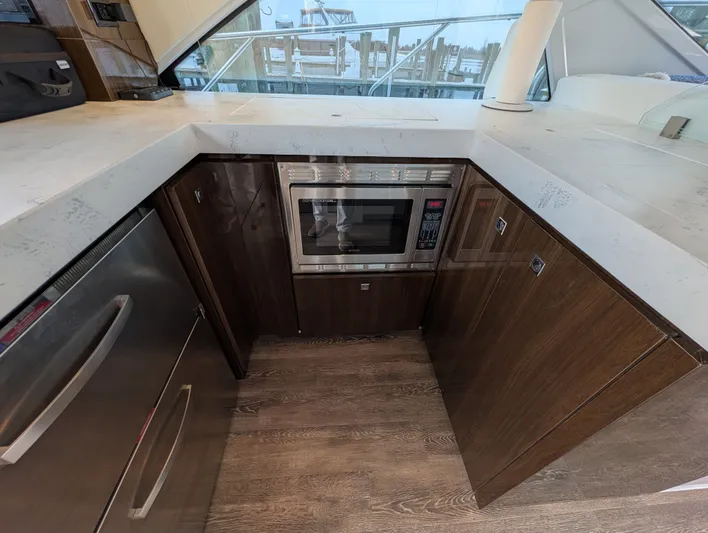 Emilia Yacht Photos Pics 2022 Cruisers Yachts 54 Cantius kitchen area with microwave.