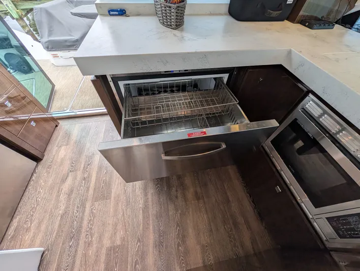 Emilia Yacht Photos Pics Interior of 2022 Cruisers Yachts 54 Cantius with open drawer.