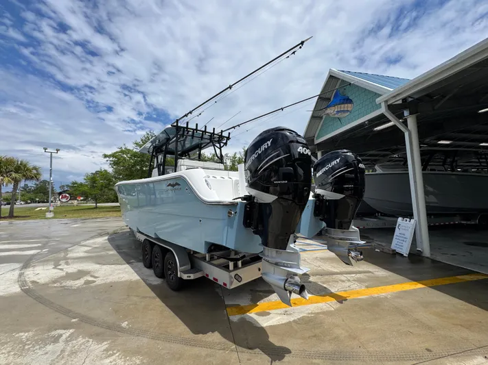  Yacht Photos Pics 2022 Invincible 33 Catamaran with twin Mercury engines on a trailer.