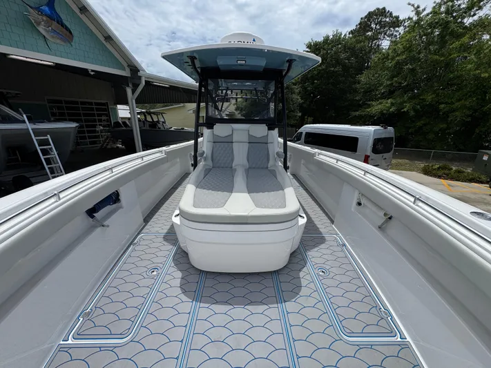  Yacht Photos Pics 2022 Invincible 33 Catamaran with sleek deck design and comfortable seating.