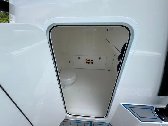  Yacht Photos Pics Interior view of 2022 Invincible 33 Catamaran's compact bathroom space.