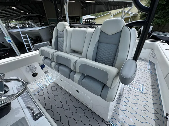  Yacht Photos Pics 2022 Invincible 33 Catamaran interior with luxurious seating and modern design.