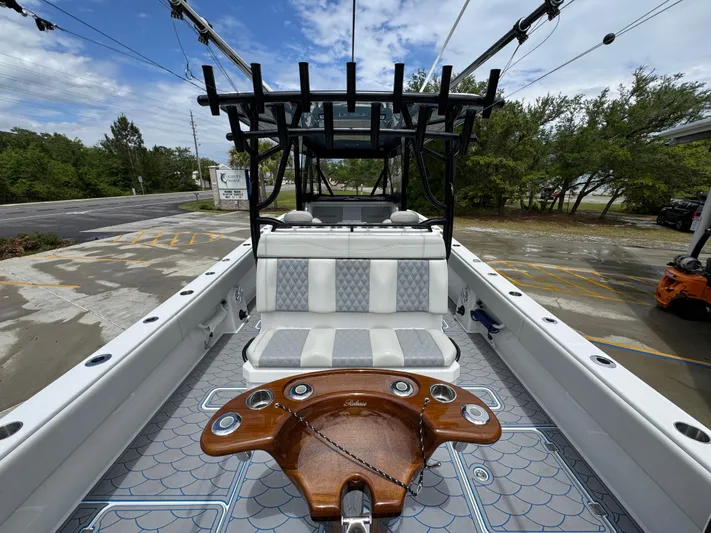  Yacht Photos Pics 2022 Invincible 33 Catamaran interior with seating and fishing rod holders.