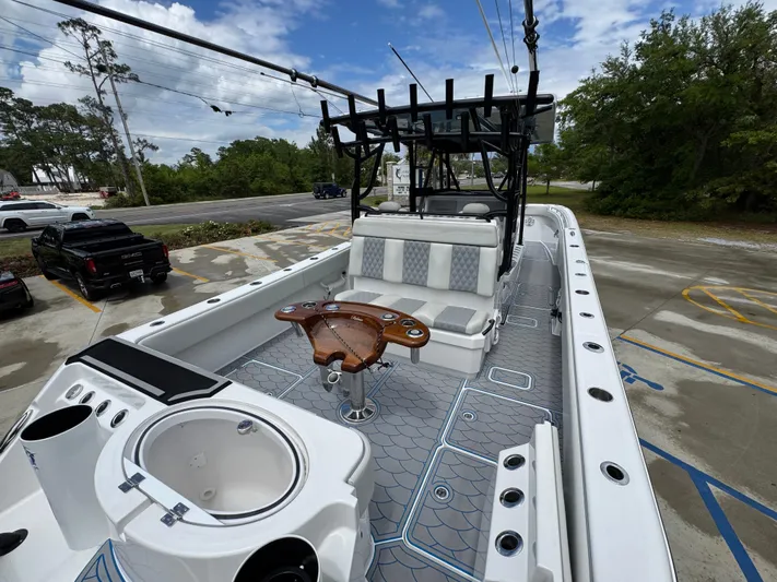  Yacht Photos Pics 2022 Invincible 33 Catamaran with spacious deck, seating, and fishing amenities.