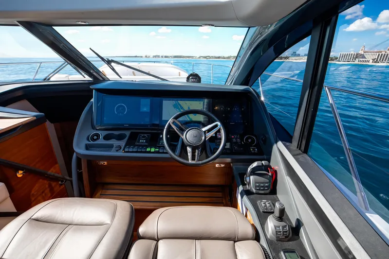 Mermoo Too Yacht Photos Pics 2024 Princess V55 yacht cockpit with modern navigation system and luxurious seating.