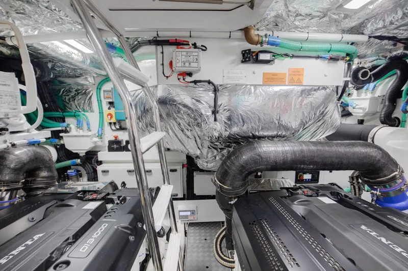 Mermoo Too Yacht Photos Pics Engine room of 2024 Princess V55 yacht with advanced machinery and insulation.