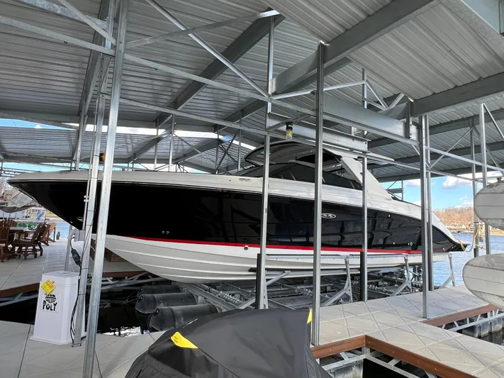  Yacht Photos Pics 2022 Sea Ray 400 SLX boat docked in a covered marina.