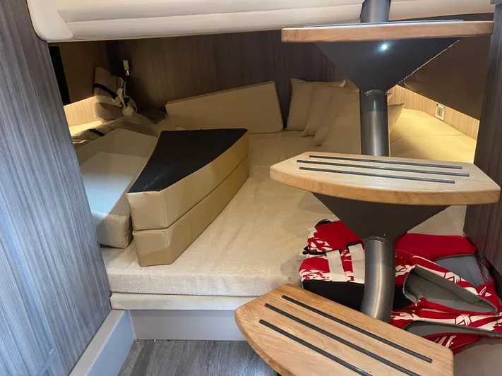  Yacht Photos Pics 2022 Sea Ray 400 SLX cabin interior with modern staircase and cozy seating area.