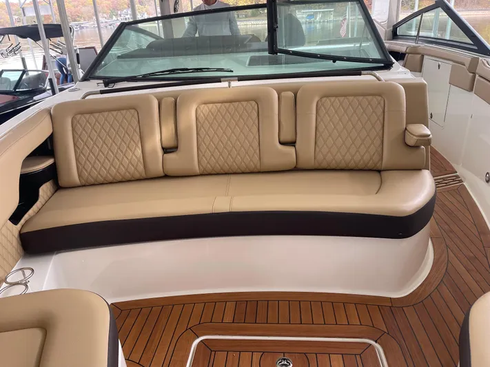  Yacht Photos Pics Luxurious 2022 Sea Ray 400 SLX boat interior with tan leather seating and wood flooring.