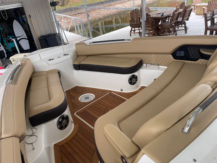  Yacht Photos Pics Luxurious interior of 2022 Sea Ray 400 SLX boat with tan seating and wood flooring.