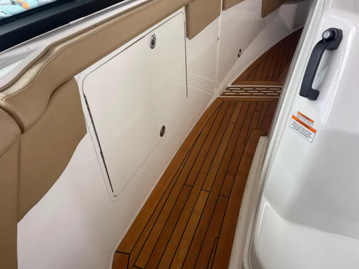  Yacht Photos Pics 2022 Sea Ray 400 SLX boat interior with teak flooring and beige accents.