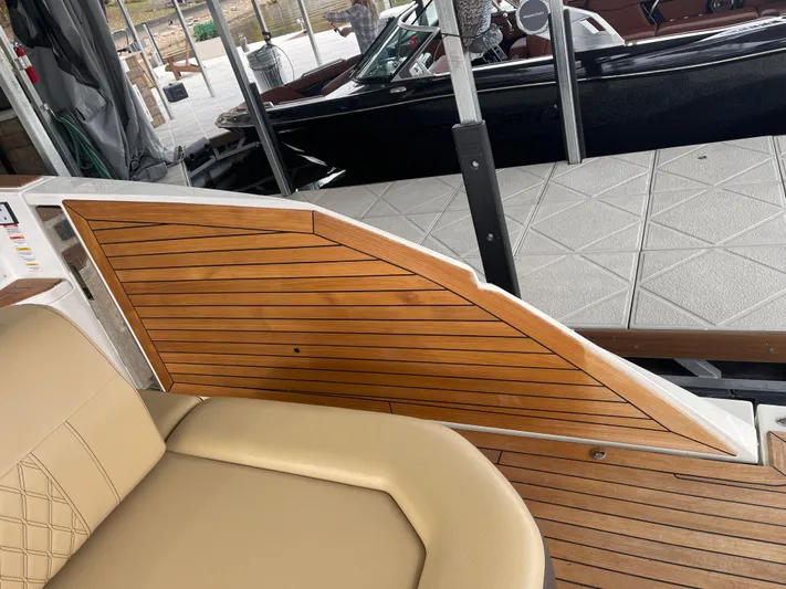  Yacht Photos Pics 2022 Sea Ray 400 SLX boat interior with tan seating and wooden paneling.