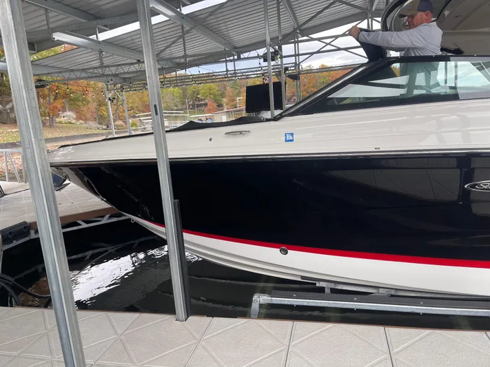  Yacht Photos Pics 2022 Sea Ray 400 SLX boat docked under a covered marina.