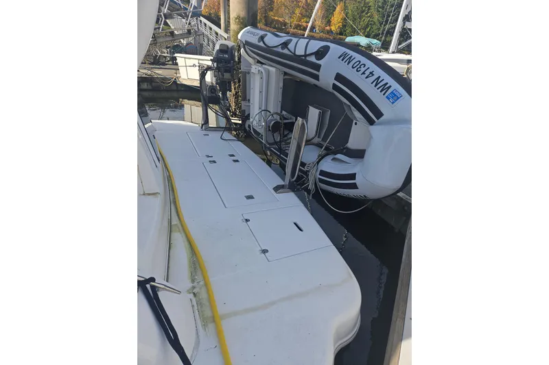 Long Time Comin' Yacht Photos Pics 2000 Cruisers Yachts 4450 Express Motoryacht with inflatable boat on deck.