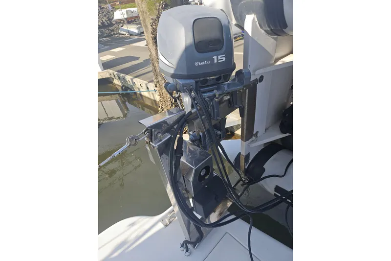 Long Time Comin' Yacht Photos Pics Outboard motor on 2000 Cruisers Yachts 4450 Express Motoryacht, docked at marina.