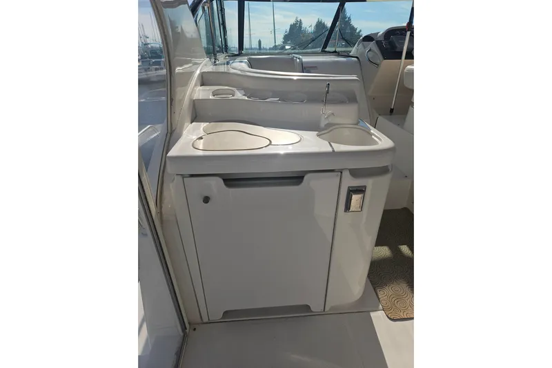 Long Time Comin' Yacht Photos Pics 2000 Cruisers Yachts 4450 Express Motoryacht interior with sink and counter area.