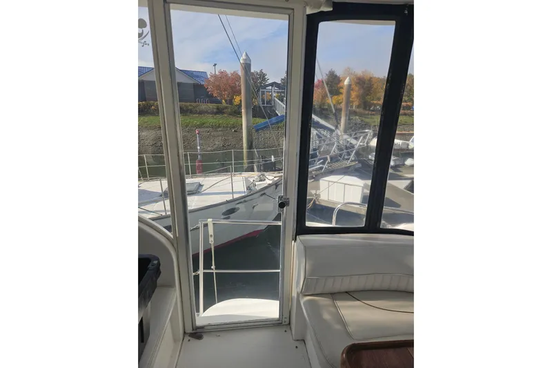 Long Time Comin' Yacht Photos Pics Interior view of 2000 Cruisers Yachts 4450 Express Motoryacht docked at marina.