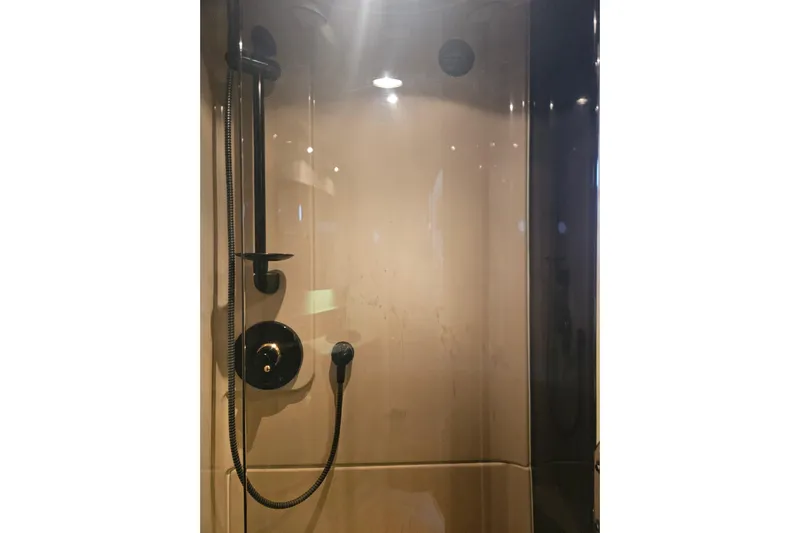 Long Time Comin' Yacht Photos Pics Shower area in 2000 Cruisers Yachts 4450 Express Motoryacht, featuring modern fixtures.