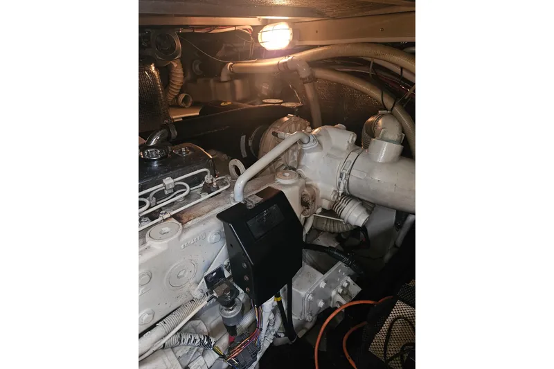 Long Time Comin' Yacht Photos Pics Engine room of 2000 Cruisers Yachts 4450 Express Motoryacht, illuminated and detailed.