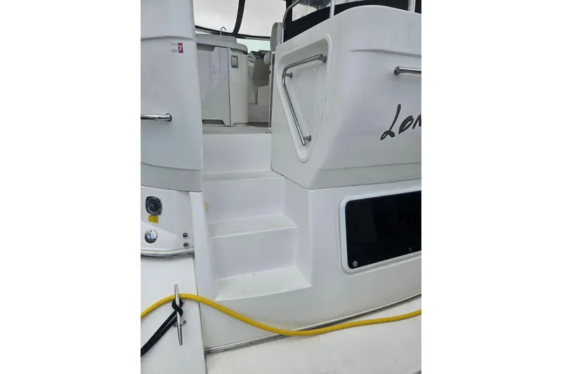 Long Time Comin' Yacht Photos Pics 2000 Cruisers Yachts 4450 Express Motoryacht, rear view with steps and railing.