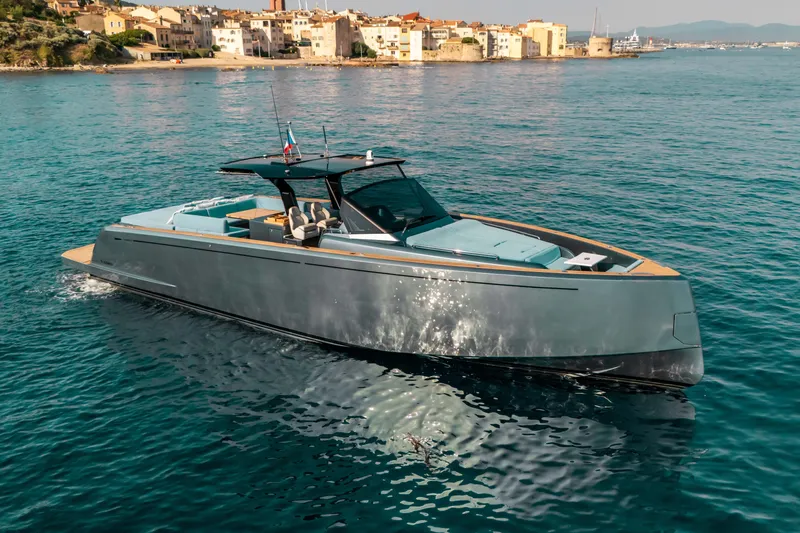  Yacht Photos Pics Luxury 2021 Pardo Yachts 50 cruising near a scenic coastal town.