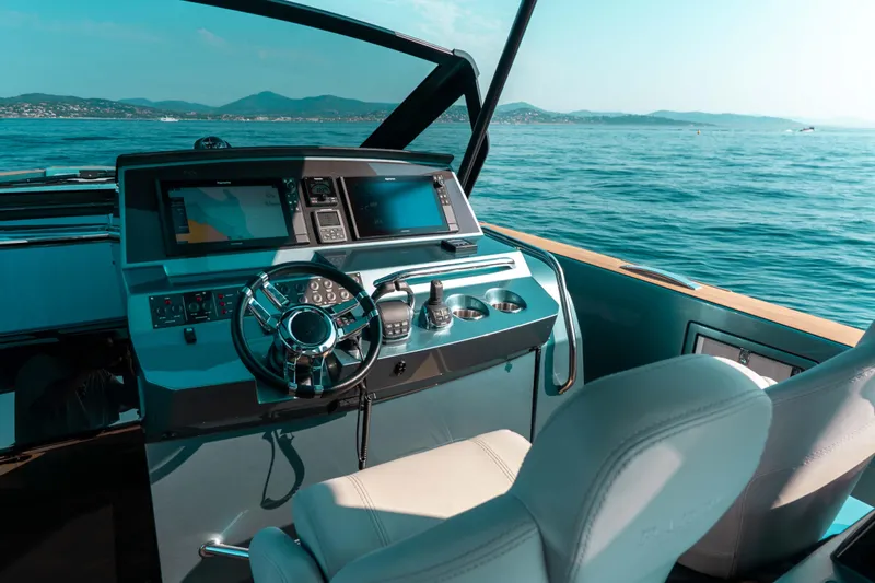  Yacht Photos Pics Cockpit of 2021 Pardo Yachts 50, featuring modern navigation equipment and luxurious seating.
