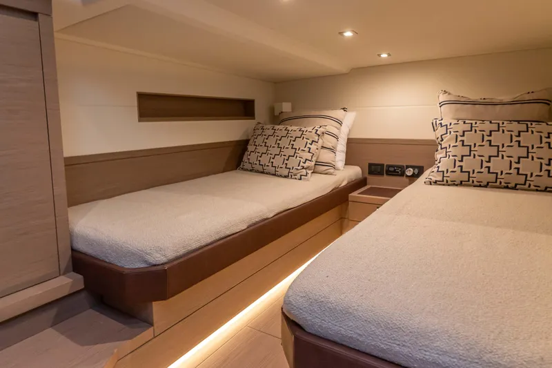  Yacht Photos Pics Luxurious cabin interior of 2021 Pardo Yachts 50 with twin beds and modern decor.