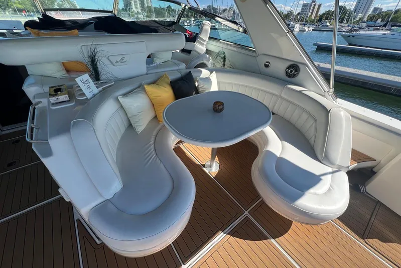 Abeona Yacht Photos Pics Luxurious 1997 Sea Ray 500 Sundancer yacht interior with elegant seating and table.