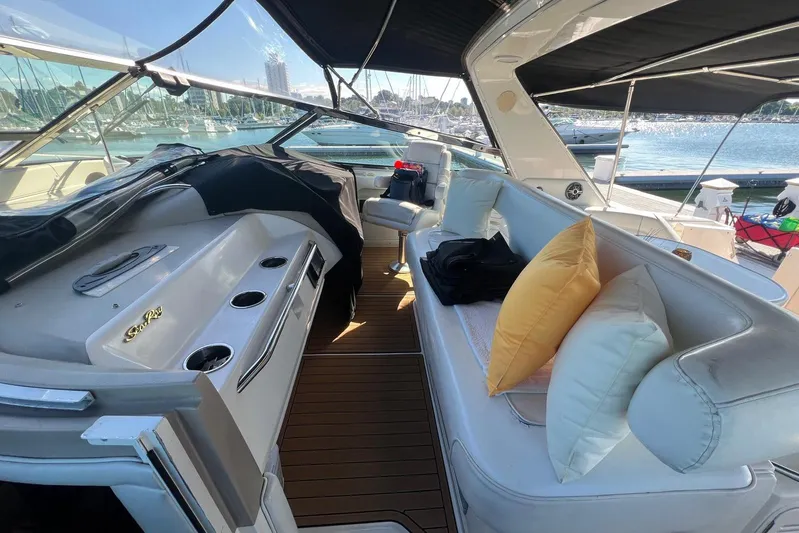 Abeona Yacht Photos Pics Luxurious 1997 Sea Ray 500 Sundancer yacht interior with plush seating and scenic marina view.