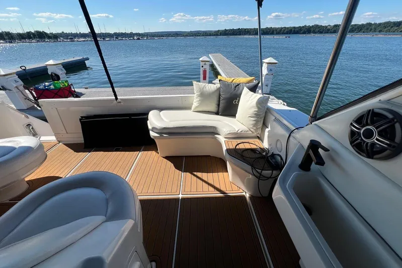 Abeona Yacht Photos Pics 1997 Sea Ray 500 Sundancer yacht interior with cushioned seating and scenic water view.