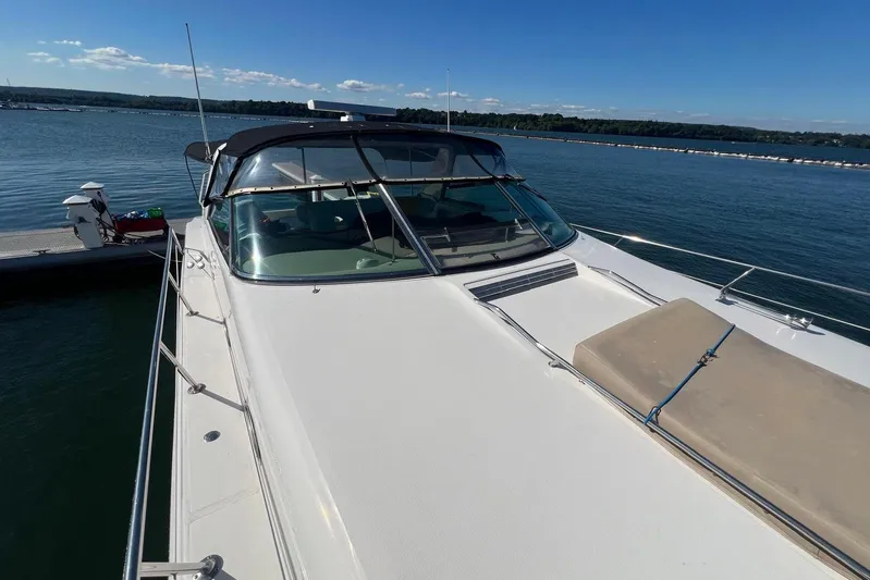 Abeona Yacht Photos Pics 1997 Sea Ray 500 Sundancer yacht docked on a sunny day, showcasing sleek design.
